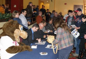 The autograph line: TC Bear, Jake Mauer, Ron Gardenhire, Brian Dozier, Terry Steinbach, N.J. Hermsen