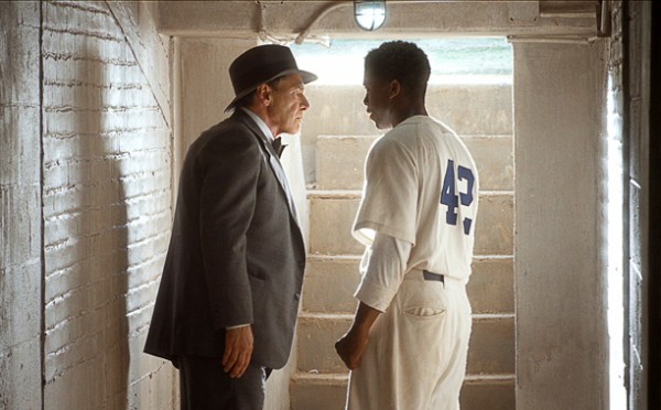 (L-r) HARRISON FORD as Branch Rickey and CHADWICK BOSEMAN as Jackie Robinson in Warner Bros. Pictures’ and Legendary Pictures’ drama “42,” a Warner Bros. Pictures release.