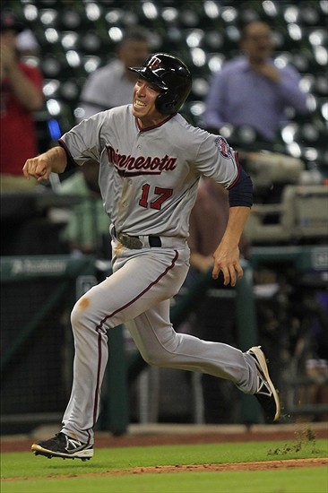 Sep 3, 2013; Houston, TX, USA; Minnesota Twins second baseman Doug Bernier (17) sprints home against the Houston Astros during the twelfth inning at Minute Maid Park. The Twins won 9-6. Mandatory Credit: Thomas Campbell-USA TODAY Sports