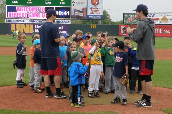 Brett Doe and John Curtiss getting organized with some campers on the mound