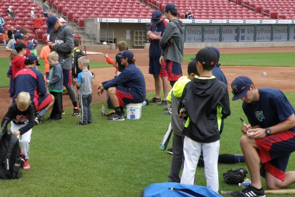 Kernels players signing autographs after the camp wrapped up