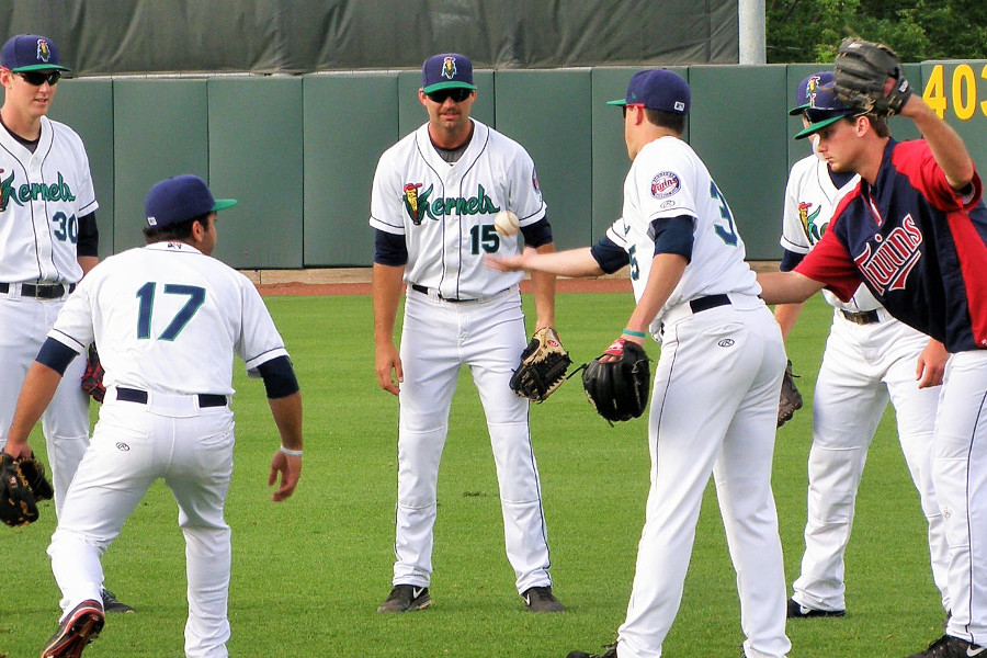 Randy LeBlanc (15) in a pregame ritual game of flip with other Kernels pitchers (Photo: SD Buhr)