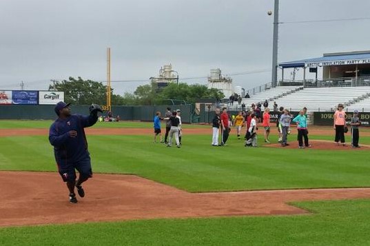 Kernels hitting coach Tommy Watkins was directing things at the camp but pitched in with the workout stations, too