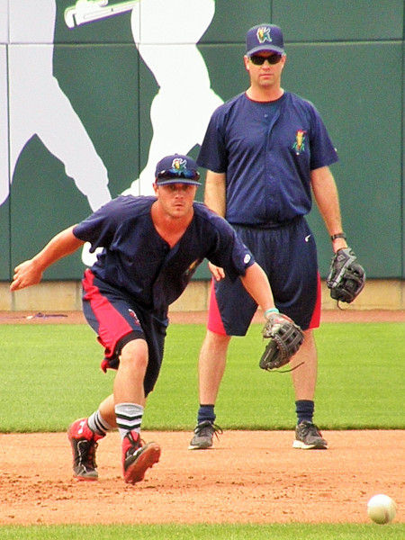 Pat Kelly gets pregame work in at third base under the watchful eye of Kernels manager Jake Mauer (Photo: SD Buhr)