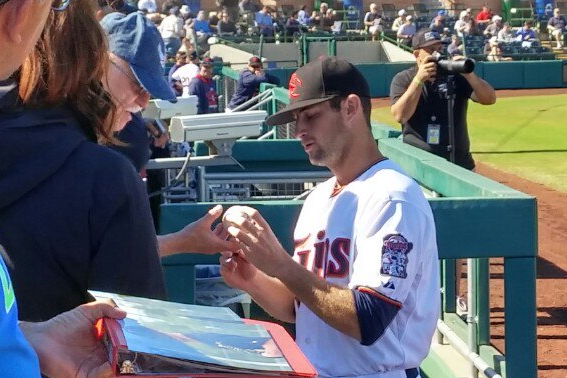 Jake Reed signing for fans before Thursday's game.