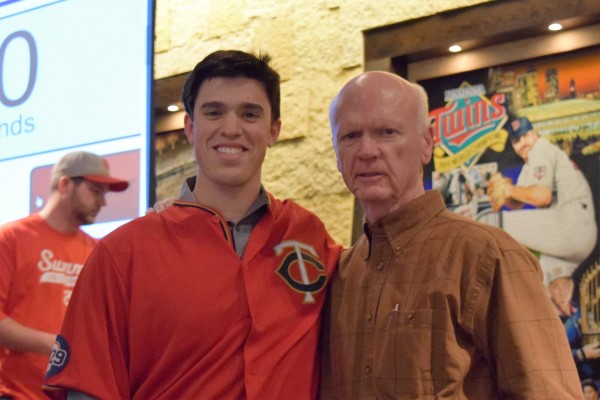 Trevor Hildenberger and Terry Ryan pose after participating in some fan games in the Champions Club