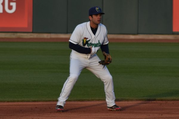 Rafael Valera - I'm not sure this is the fielding position they teach, but then the coaches don't typically assume you'll be trying to keep your throwing hand warm in 38 degree temps, either.