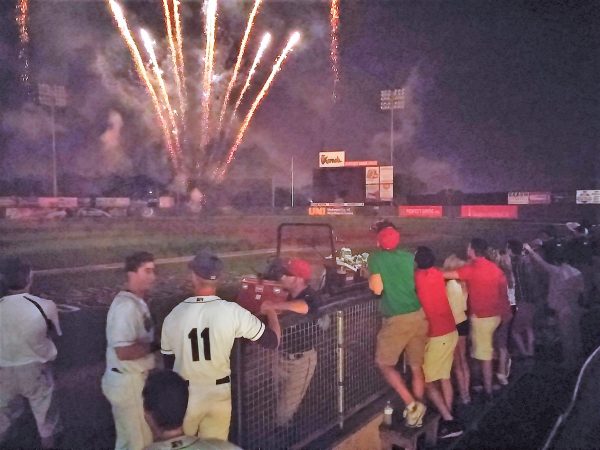 AJ Murray (left) and Sam Clay (11) take in the postgame fireworks with the rest of the crowd.