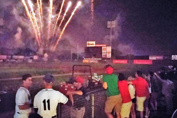 No, it's not the greatest picture in the world, but the postgame fireworks were outstanding. Here, AJ Murray and Sam Clay take them in along with Kernels staff members gathered in the home dugout.