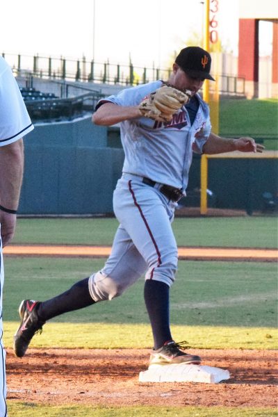 Mason Melotakis covering first base on a ground ball to the first baseman